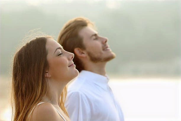 Couple breathing deeply and calmly